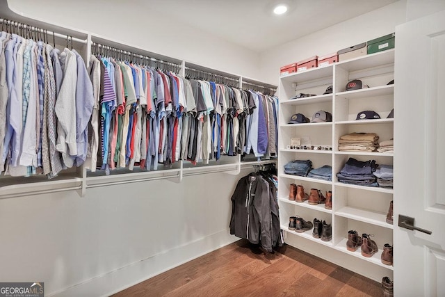 spacious closet with wood finished floors