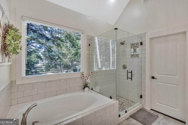 full bath with lofted ceiling, visible vents, a garden tub, and a shower stall