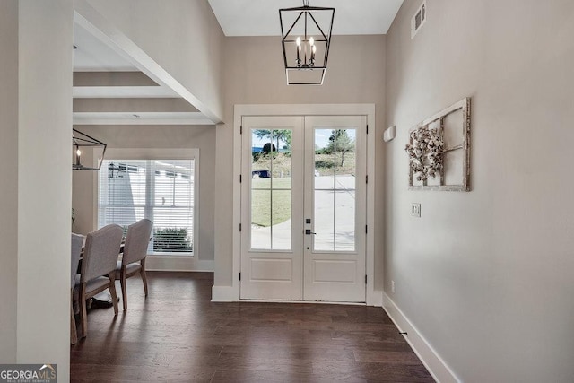 doorway featuring dark wood-style floors, visible vents, a wealth of natural light, and french doors