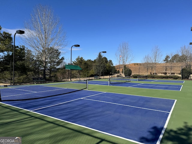 view of sport court featuring community basketball court and fence