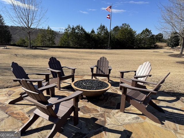 view of patio with a fire pit