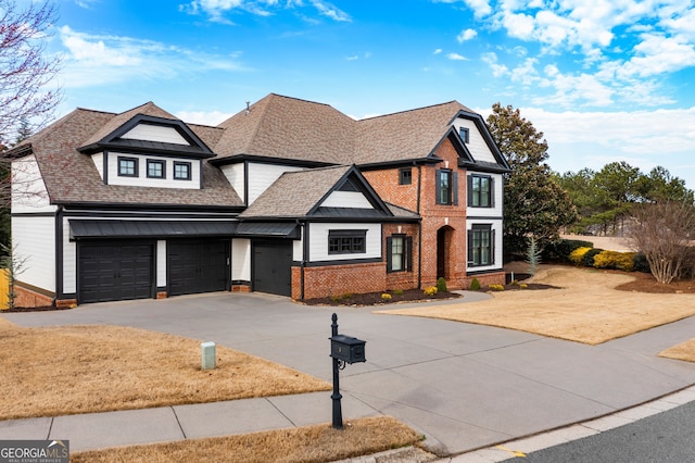 view of front of home featuring driveway, brick siding, a front lawn, and a shingled roof