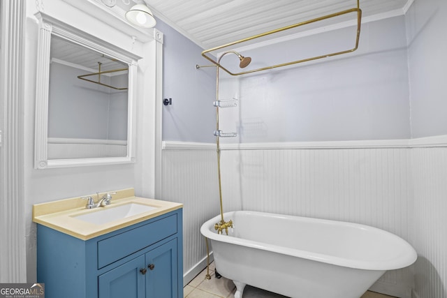 bathroom with a shower, a freestanding tub, wainscoting, and vanity