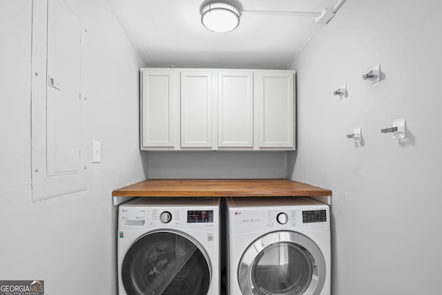 laundry area with washer and dryer and cabinet space