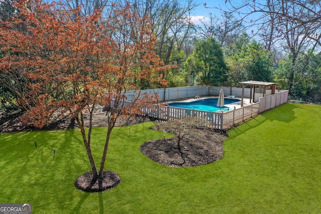 view of pool with a fenced in pool, a fenced backyard, and a yard