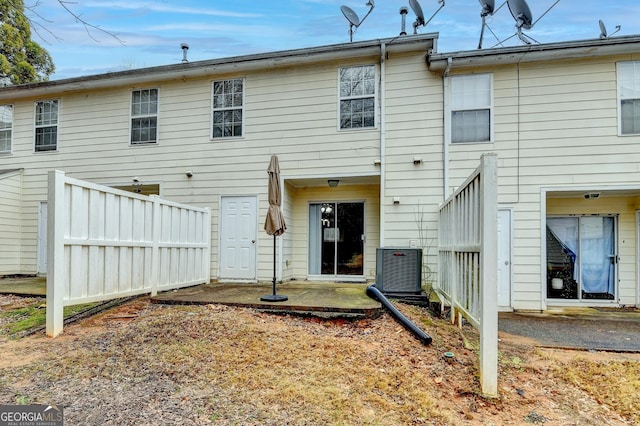 back of property with a patio, central AC unit, and fence