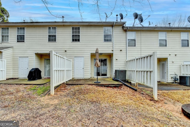 back of house featuring central air condition unit