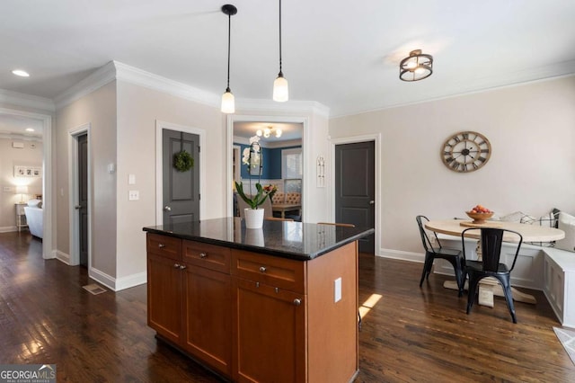 kitchen with crown molding, dark wood-style flooring, and baseboards