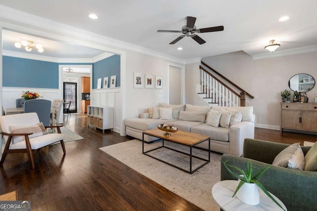 living room with a wainscoted wall, crown molding, wood finished floors, and recessed lighting