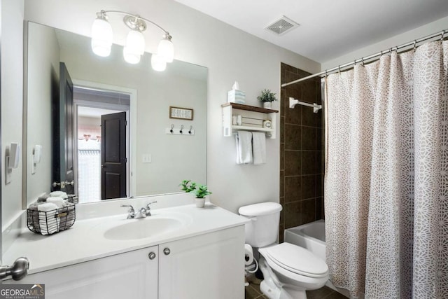 bathroom with shower / bathtub combination with curtain, visible vents, vanity, and toilet