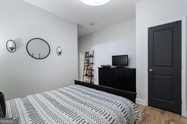 bedroom featuring light wood-style flooring