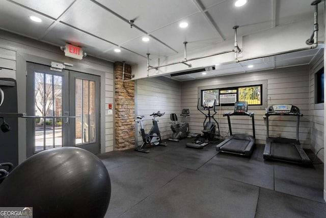 gym with french doors and recessed lighting