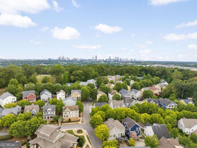 birds eye view of property with a residential view