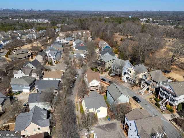 birds eye view of property with a residential view