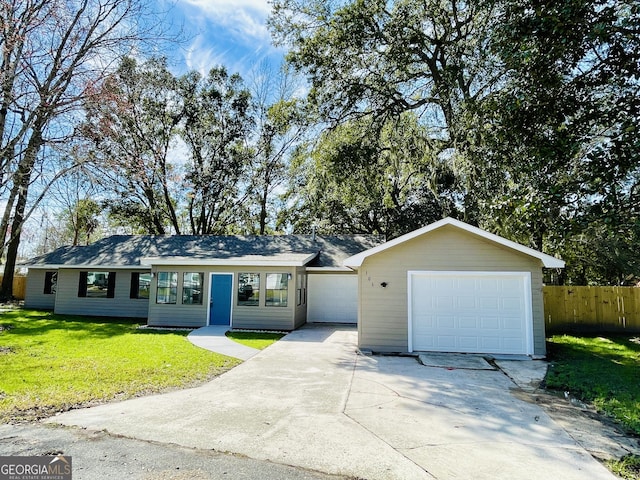 ranch-style home with a garage, concrete driveway, fence, and a front lawn