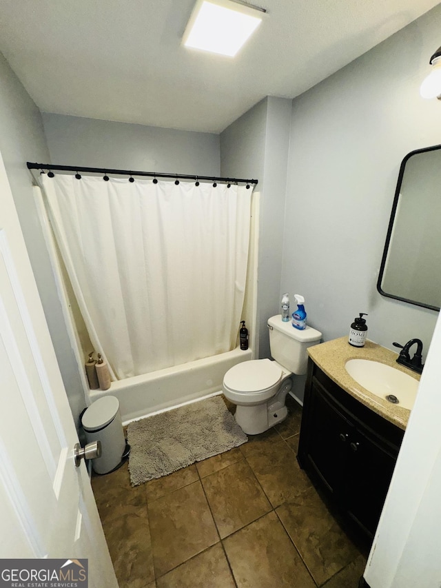 full bathroom featuring toilet, shower / bath combination with curtain, vanity, and tile patterned floors