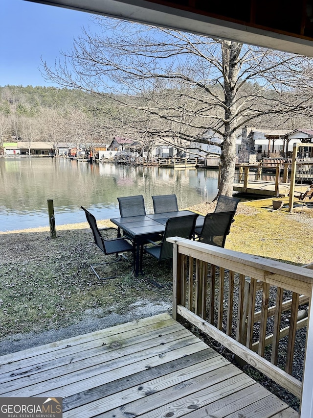 wooden terrace with a water view