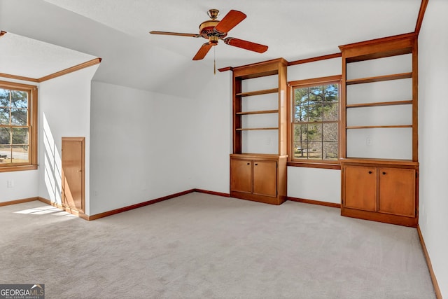 bonus room featuring light carpet and baseboards