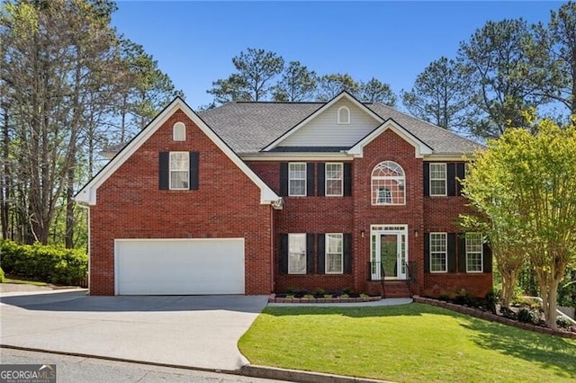 colonial-style house featuring brick siding, driveway, a garage, and a front lawn
