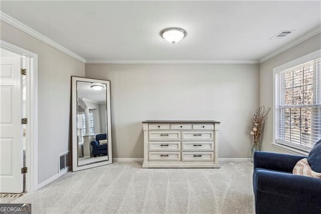 sitting room featuring ornamental molding, light colored carpet, and visible vents