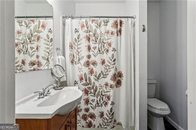 full bath featuring toilet and vanity