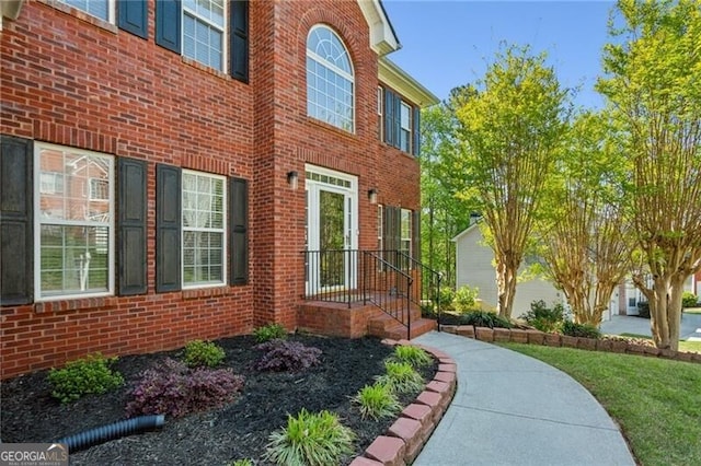 view of home's exterior featuring brick siding