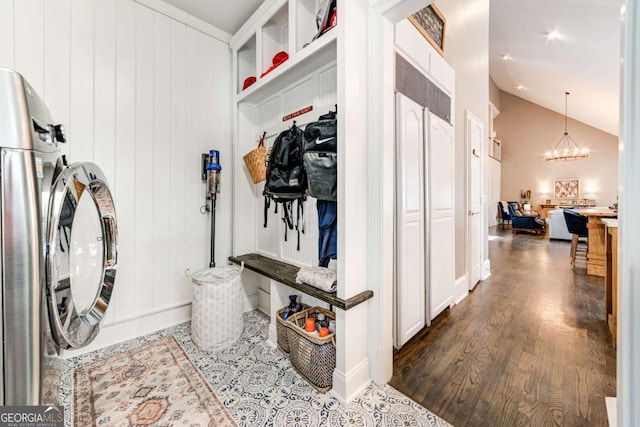 interior space with laundry area, baseboards, a chandelier, washer / clothes dryer, and dark wood-type flooring