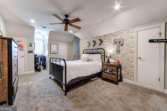 carpeted bedroom featuring ceiling fan, baseboards, visible vents, and vaulted ceiling