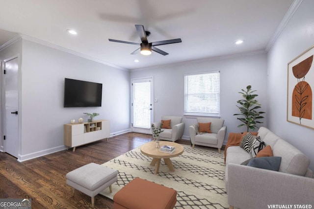 living area featuring crown molding, baseboards, and wood finished floors