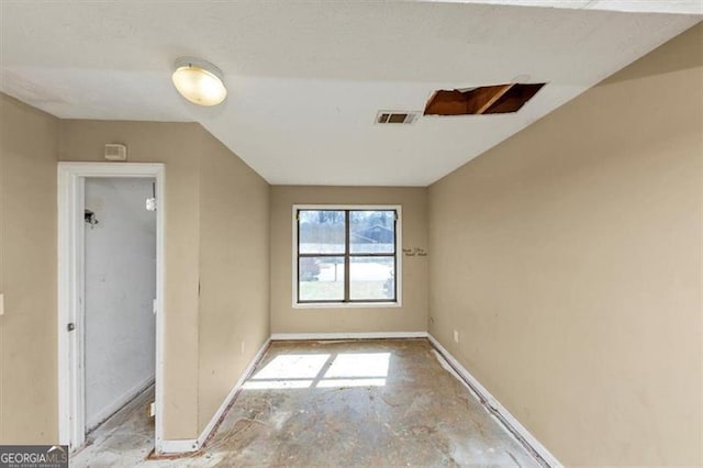 empty room featuring visible vents and baseboards