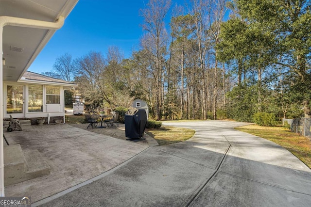 exterior space featuring fence and a patio