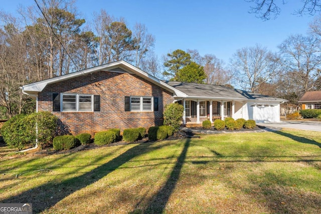 ranch-style house featuring a garage, a front yard, brick siding, and driveway