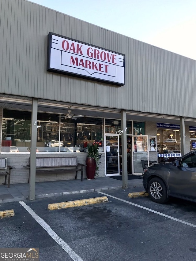 view of building exterior with uncovered parking