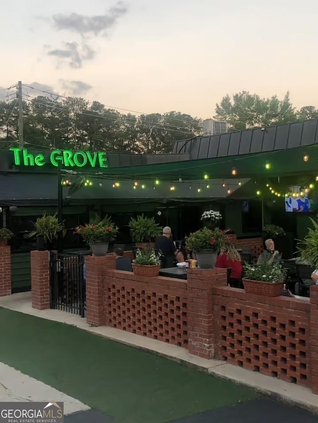 view of patio terrace at dusk