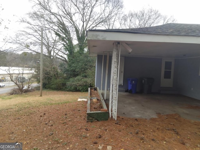 exterior space with a carport