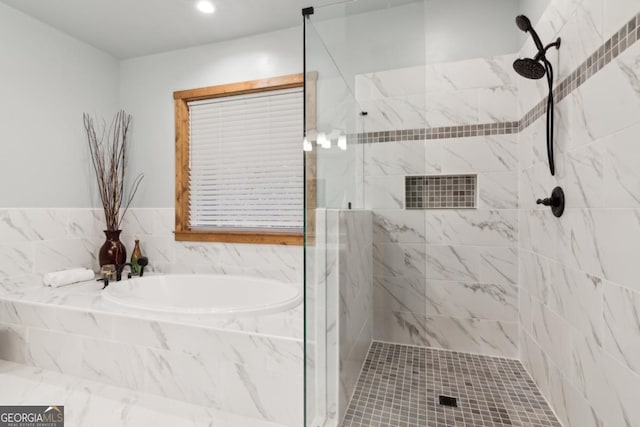 full bathroom with a garden tub, tiled shower, and recessed lighting