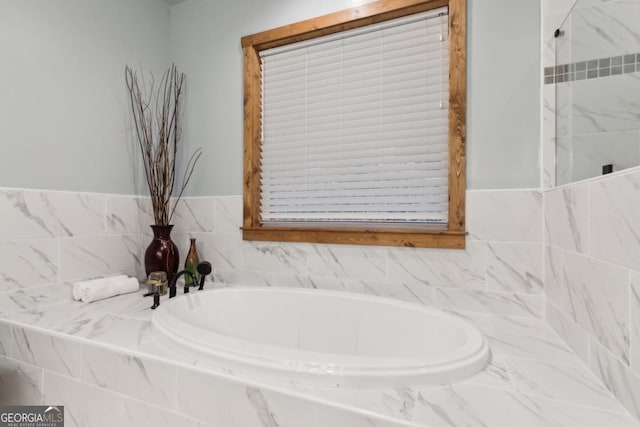 full bath with a garden tub