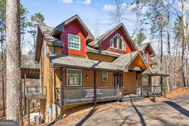 view of front of home featuring a porch and a shingled roof