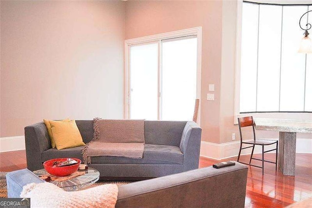 living room featuring wood finished floors and baseboards