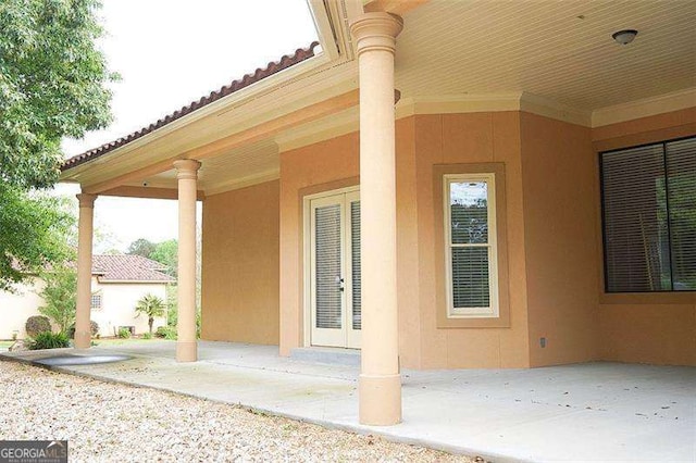 exterior space featuring a patio and stucco siding