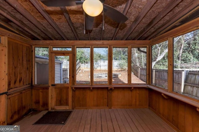 unfurnished sunroom with lofted ceiling