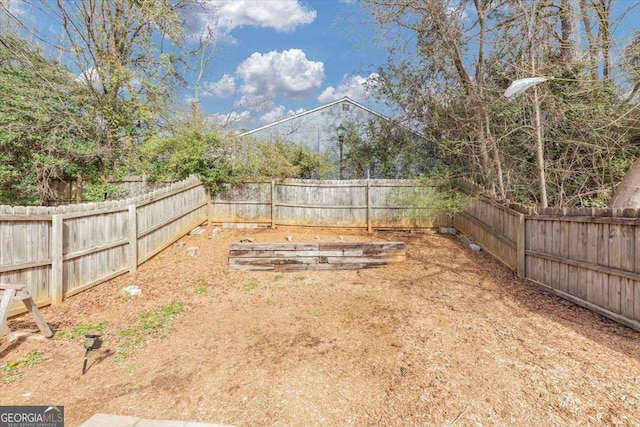 view of yard with a fenced backyard