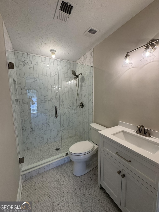 full bathroom with toilet, a textured ceiling, a shower stall, and visible vents