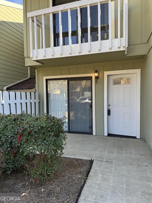 property entrance with a balcony