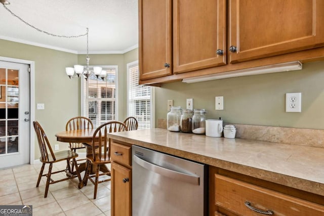 kitchen with light tile patterned floors, brown cabinets, crown molding, a chandelier, and stainless steel dishwasher