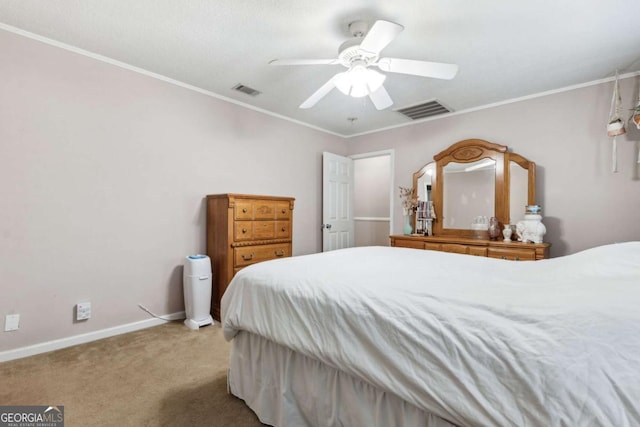 bedroom with baseboards, carpet, visible vents, and crown molding