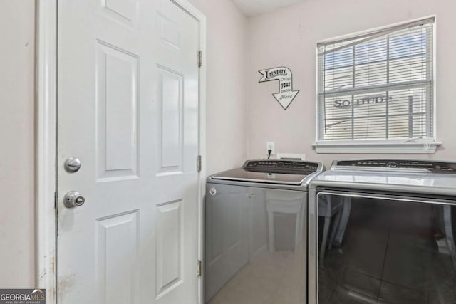 clothes washing area with laundry area and washing machine and clothes dryer