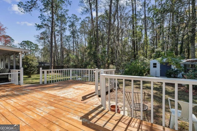 deck featuring a shed and an outdoor structure