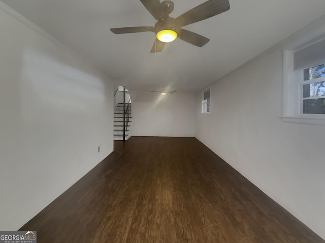 interior space with ceiling fan, stairway, and wood finished floors