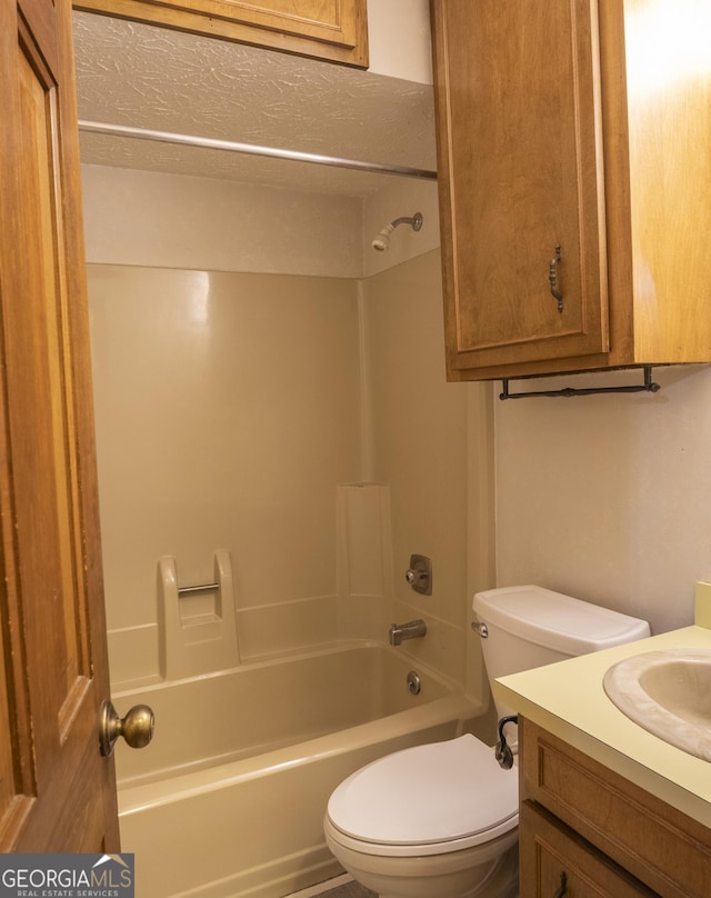 bathroom with shower / bath combination, vanity, and toilet